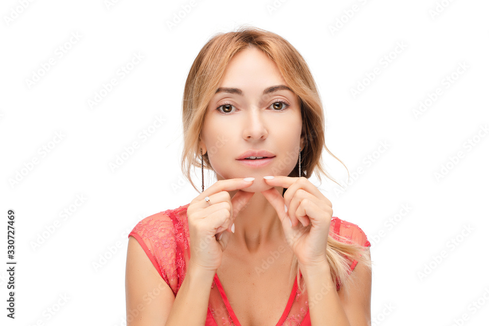 Studio portrait of a beautiful Caucasian woman with no make up touching her skin. Plastic surgery concept. Beauty concept. Skincare concept. Isolate on white. Studio portrait of a beautiful Caucasian woman with no make up touching her skin. Plastic surgery concept. Beauty concept. Skincare concept. Isolate on white.
