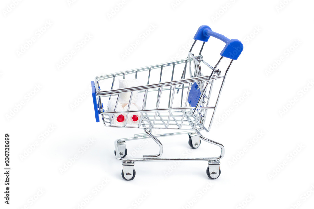 shopping cart with rolls of toilet paper on a white background. isolate shopping cart with rolls of toilet paper on a white background. isolate