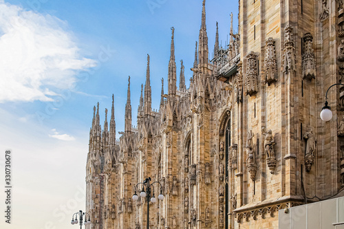 Beautiful view of the ancient Gothic spires of Milan Cathedral