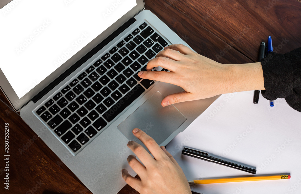 hands using the keyboard of a laptop hands using the keyboard of a laptop