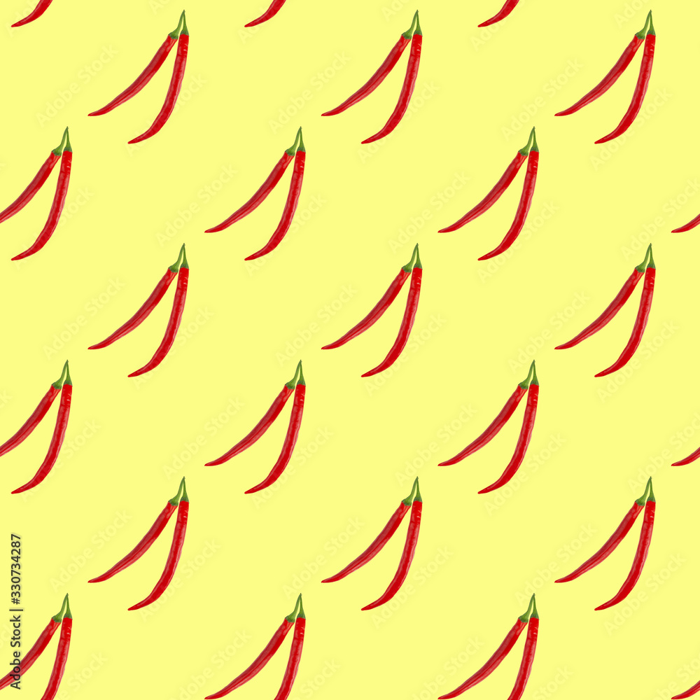 Seamless pattern of red hot chilli peppers on a yellow background. Minimal concept, isometric food texture. Seamless pattern of red hot chilli peppers on a yellow background. Minimal concept, isometric food texture.