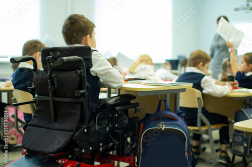 Obraz na płótnie A disabled student in a wheelchair in primary school. w salonie