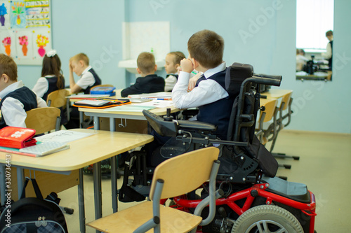 A disabled student in a wheelchair in primary school.