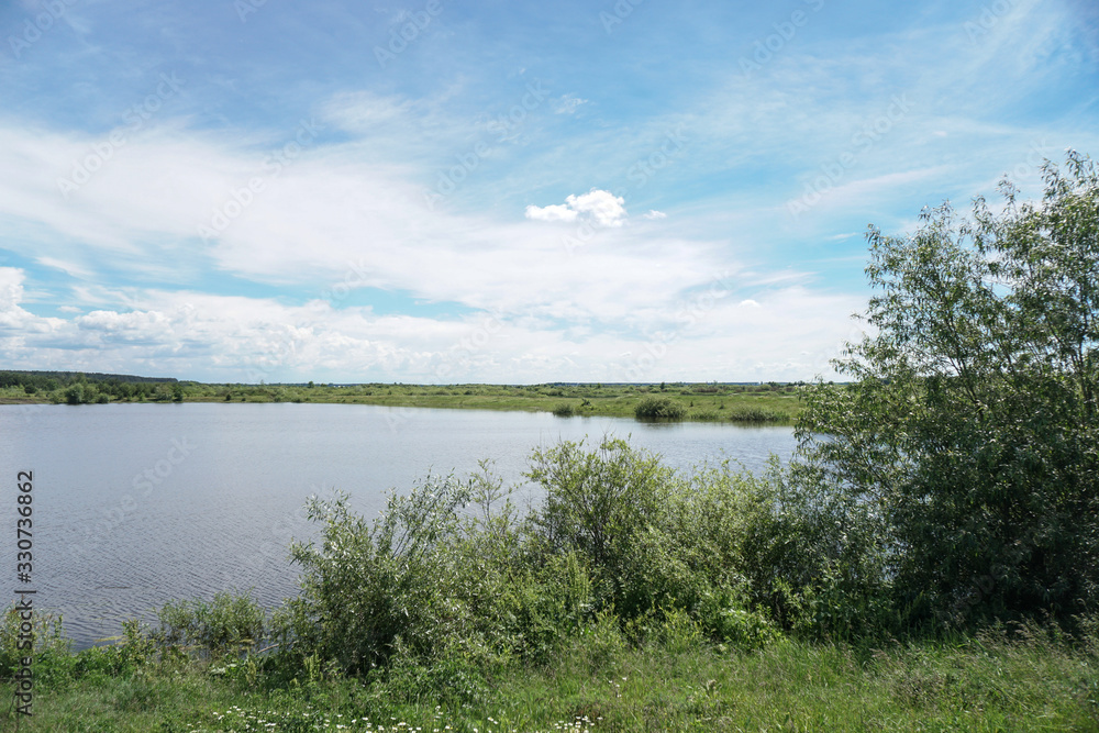 Beautiful spring river in the flowing nature. Colorful landscape in the morning and evening. Travel to deserted places of the world. Stock photo for design Beautiful spring river in the flowing nature. Colorful landscape in the morning and evening. Travel to deserted places of the world. Stock photo for design