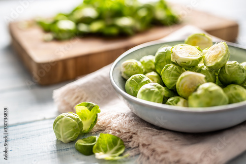 Fresh brusseles sprouts in bowl on kitchen table