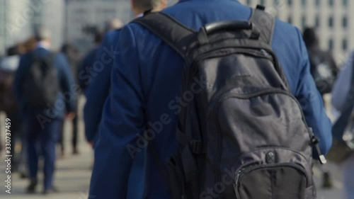 Crowd of pedestrian commuters in London on cool morning in slow motion. Clip 60c