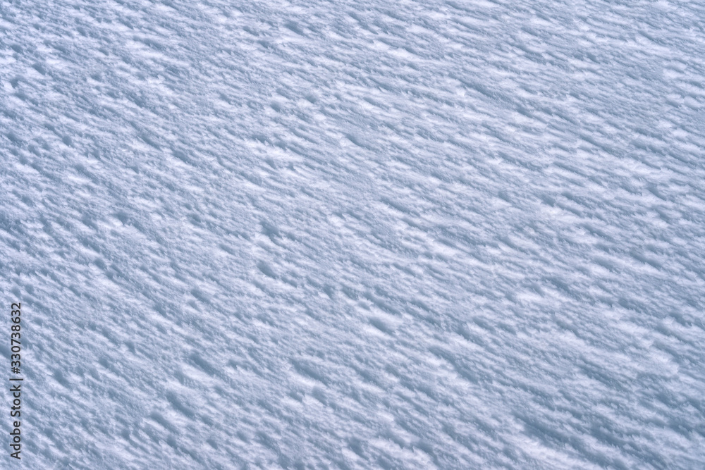 The texture of the snow after the wind in the mountains