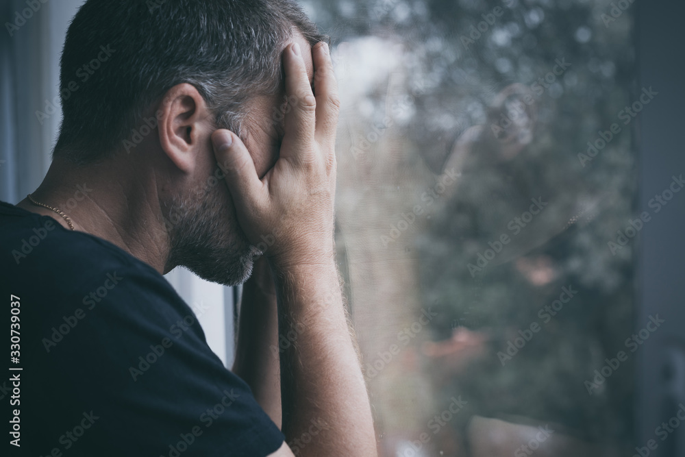 portrait one sad man standing near a window portrait one sad man standing near a window
