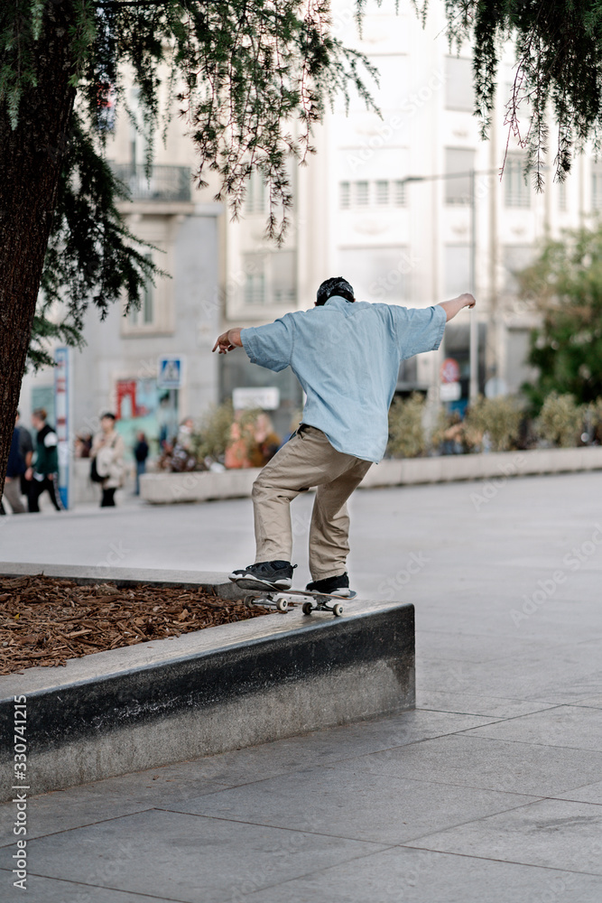 Man Skateboarding In The City