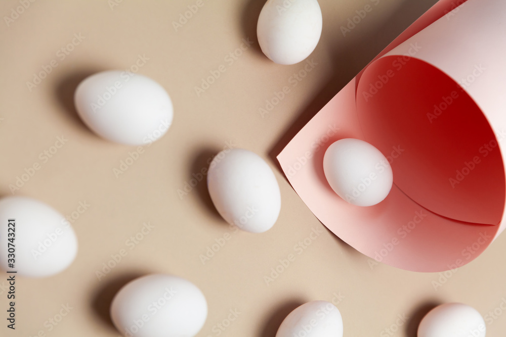 Creative Easter beige and pink background with white eggs. Easter holiday minimal concept. Creative Easter beige and pink background with white eggs. Easter holiday minimal concept.
