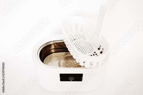 Ultrasonic cleaner on a white background photo