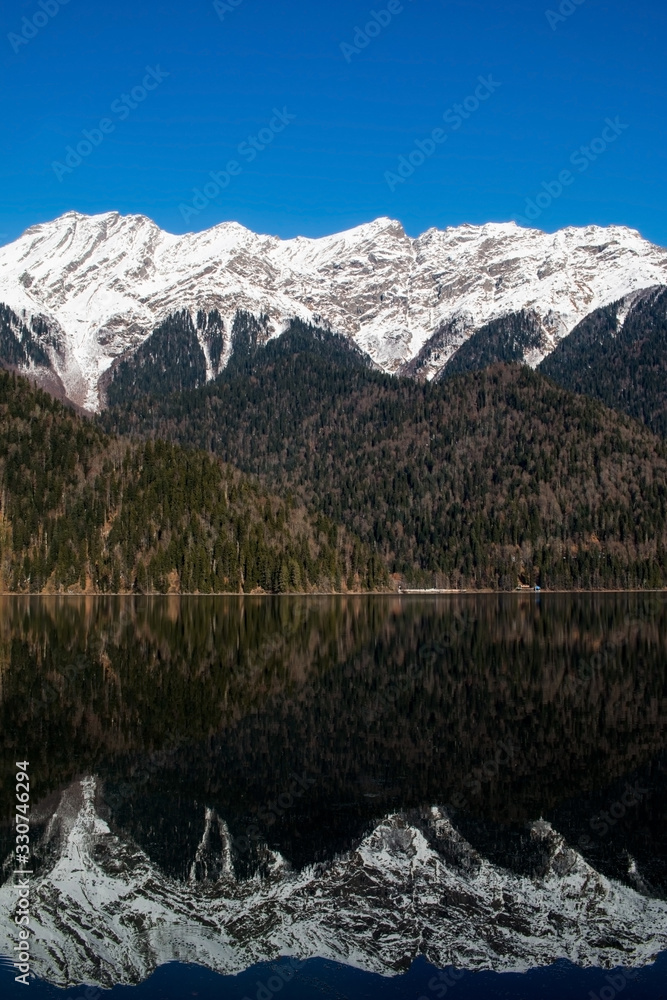 Fototapeta premium mountains in winter and mountain's reflection in the lake