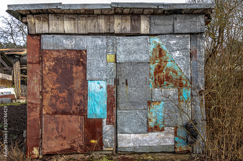 Old metal garage. well-worn texture, abandoned building