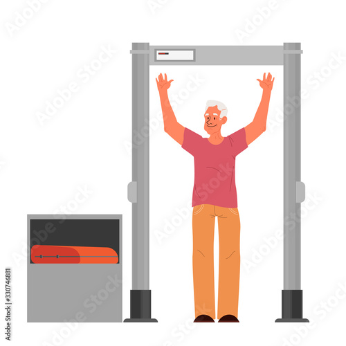 Old man going through the metal scanner. Security control