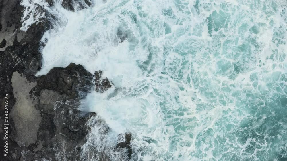 Drone aerial view of waves crashing over rocks on Lumaha'i beach on north shore of Kauai Drone aerial view of waves crashing over rocks on Lumaha'i beach on north shore of Kauai