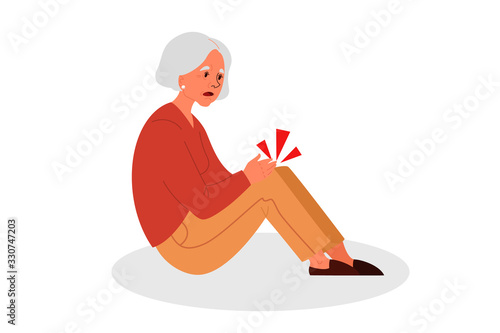 Retired women fell down. Old woman with her arm on her knee.