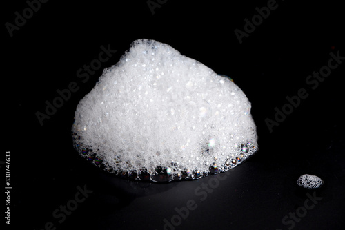 Abstract background white soapy foam texture. Shampoo foam with bubbles