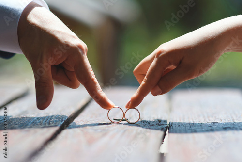 couple playing with wedding rings