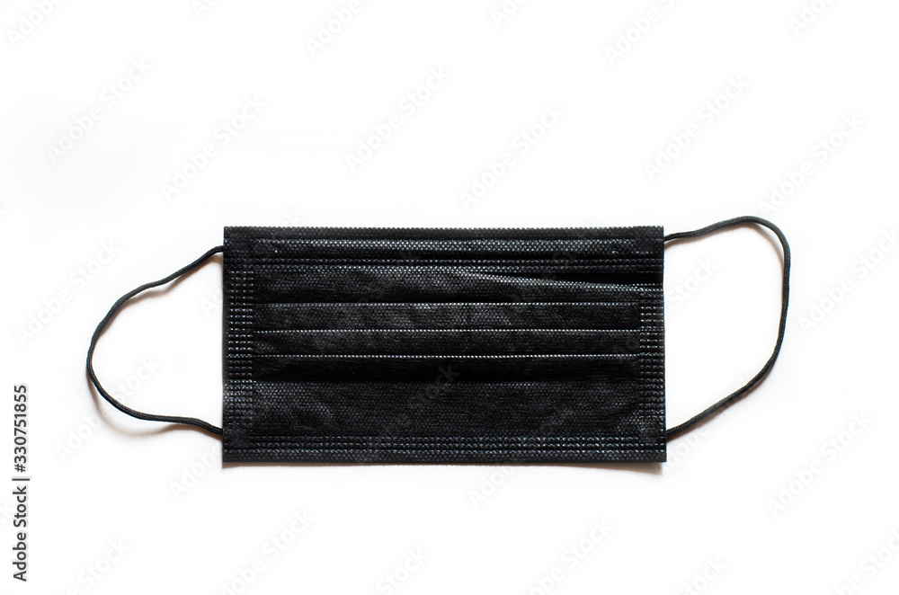 black mask on white background. concept for health care from coronavirus or covid-19 and pm 2.5. equipment protection healthy risk. black mask on white background. concept for health care from coronavirus or covid-19 and pm 2.5. equipment protection healthy risk.