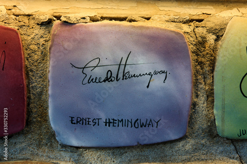 Fototapeta Alassio (SV), Italy - February 15, 2017: Ceramic icons with celebrities signature at the famous Muretto in Alassio town, Riviera dei Fiori, Savona, Liguria, Italy