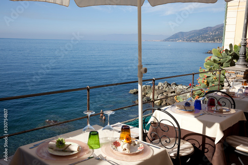 Camogli (GE), Italy - June 01, 2017: Table's' restaurant in the fishing village of Camogli, Gulf of Paradise, Portofino National Park, Genova, Liguria, Italy