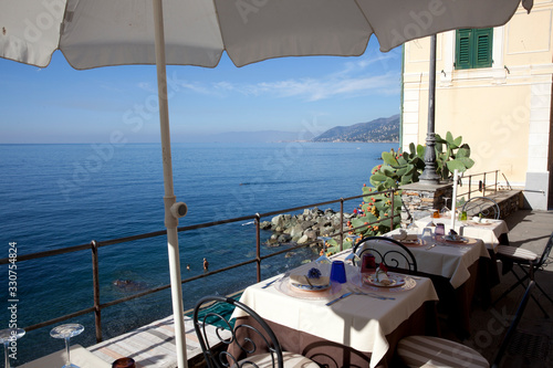 Camogli (GE), Italy - June 01, 2017: Table's' restaurant in the fishing village of Camogli, Gulf of Paradise, Portofino National Park, Genova, Liguria, Italy © PaoloGiovanni