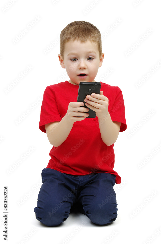 Little boy playing games on smartphone Little boy playing games on smartphone