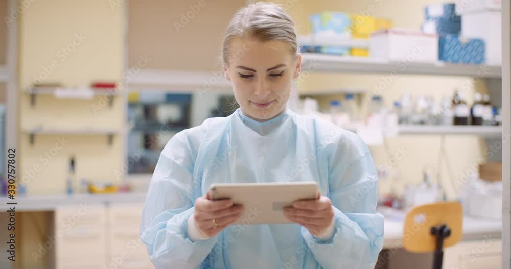 scientist using digital tablet at laboratory scientist using digital tablet at laboratory