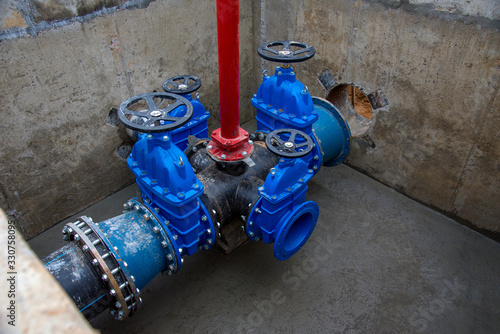 Wallpaper Mural Gate valves in valve pit of the underground piping networks. Laying water system pipeline at construction site. Water supply pipeline, pipes in trench. Sewage pumping stations, stormwater, utilities Torontodigital.ca