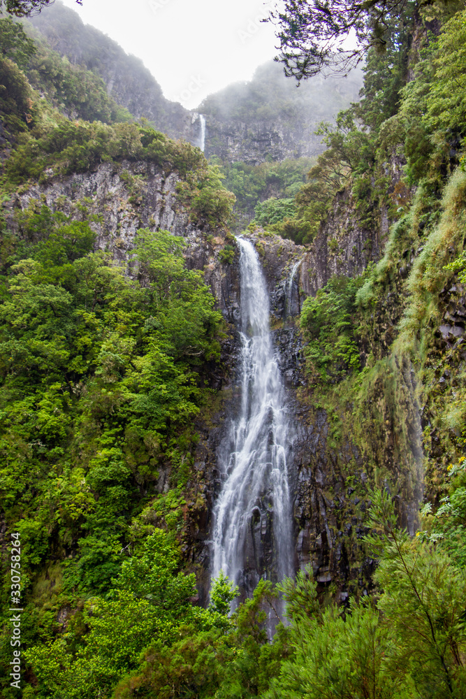 Risco waterfall on madeira island, portugal, in the middle of the tropical forest Risco waterfall on madeira island, portugal, in the middle of the tropical forest