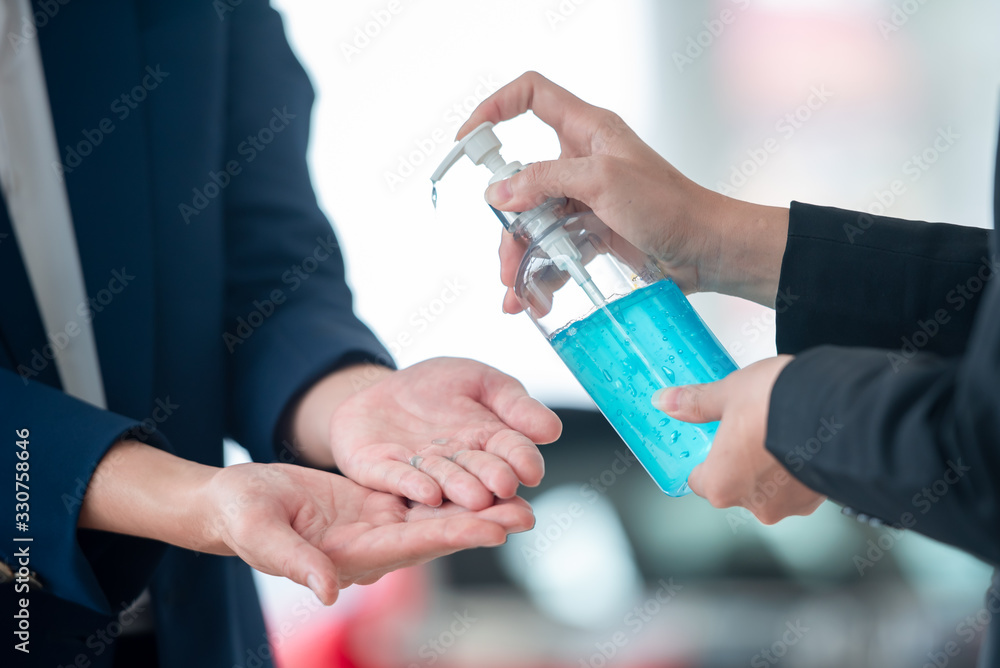 Young and young businessmen wash their hands with gel, alcohol, or soap to kill bacteria after the covid-19 virus has spread to prevent the spread of germs and bacteria.