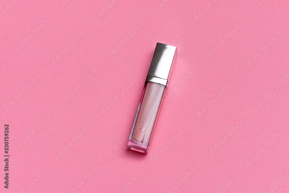 female lip gloss on a pink background female lip gloss on a pink background