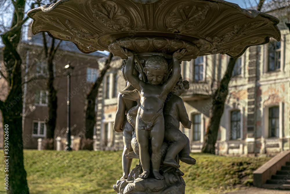 Fototapeta premium A fragment of the fountain. Figures of children