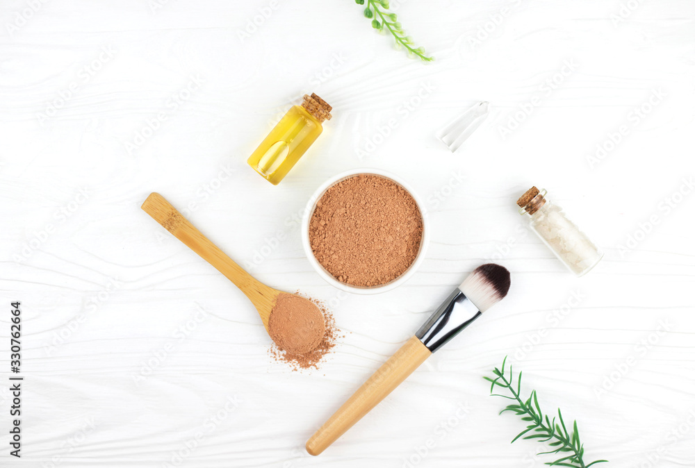 Homemade spa cosmetic set with salt, clay mask and oil on white wooden background. Copy space. Flat lay style. Homemade spa cosmetic set with salt, clay mask and oil on white wooden background. Copy space. Flat lay style.