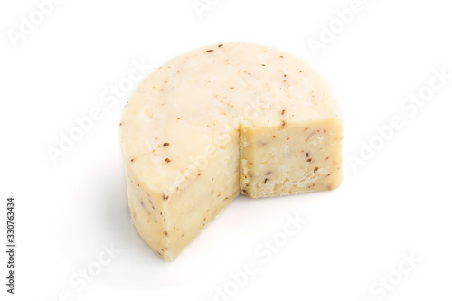 Piece of cheddar cheese isolated on white background. Side view.