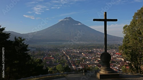 Overlooking Antigua Volcano Time Lapse with cross in foreground