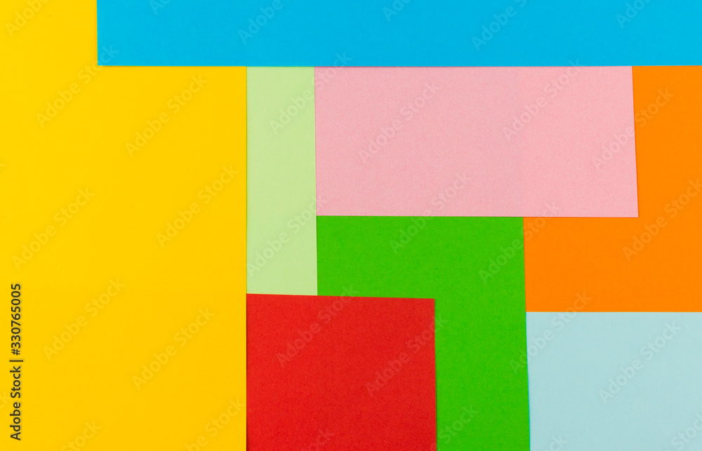 texture of bright abstract shapes of different colors lined with paper