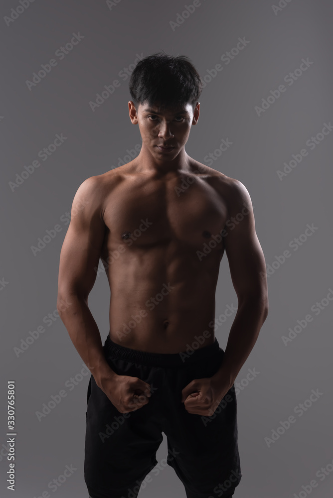 Fitness man exercise training warm up body and posing in gym,Healthy lifestyle. Fitness man exercise training warm up body and posing in gym,Healthy lifestyle.