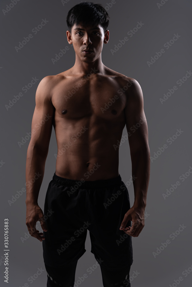 Fitness man exercise training warm up body and posing in gym,Healthy lifestyle. Fitness man exercise training warm up body and posing in gym,Healthy lifestyle.