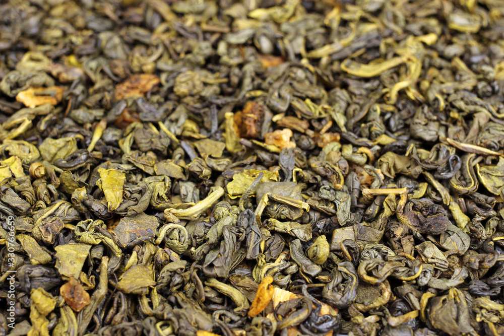 Green tea with flowers and fruits top view close up, background, texture Green tea with flowers and fruits top view close up, background, texture