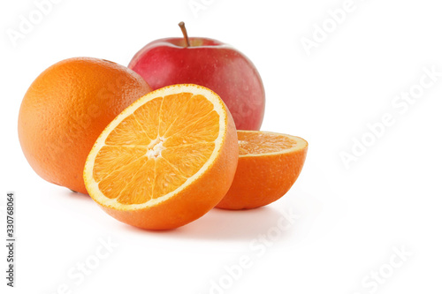 An orange and an Apple cut in half on a white background.