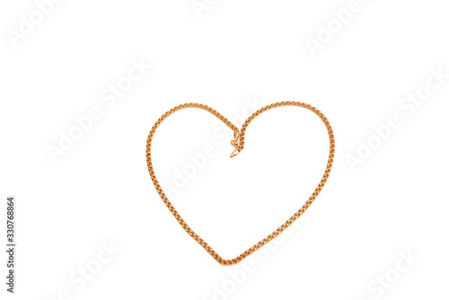 Isolated heart shaped gold chain
