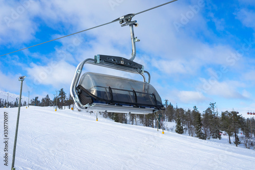 Ski slope with ski lifts on the ski resort