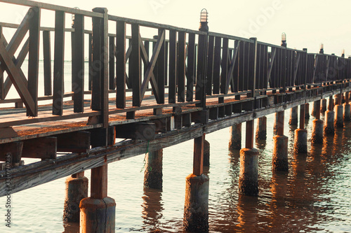 A wooden pier, at sunset. Thailand.