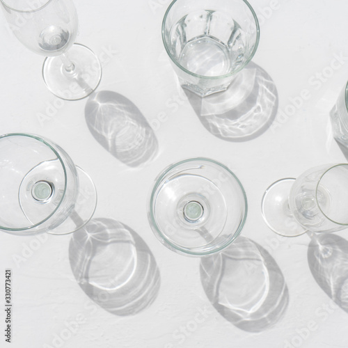 Set of wine and drinking glasses on white background