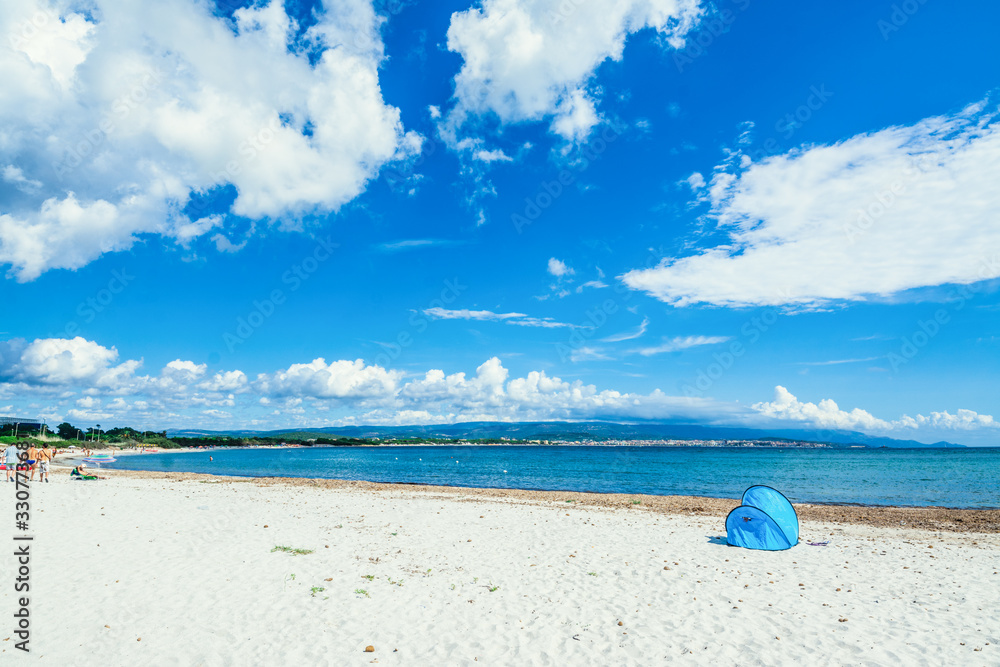 Tent on the beach on a cloudy summer day Tent on the beach on a cloudy summer day