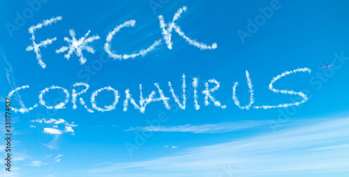 F*ck Coronavirus written in the sky with airplane contrails