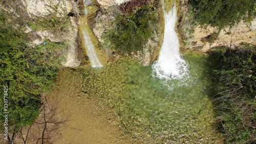 Aerial drone video of beautiful waterfall of Valanaris in Drafi area near mount Penteli, Attica, Greece photo