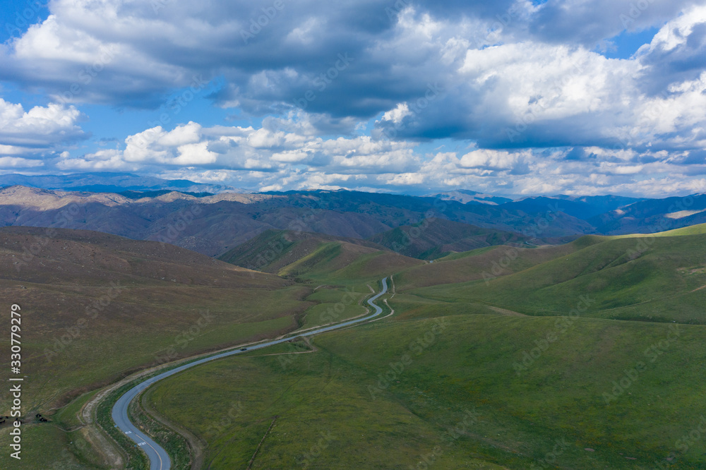 aerial view of road to the mountains