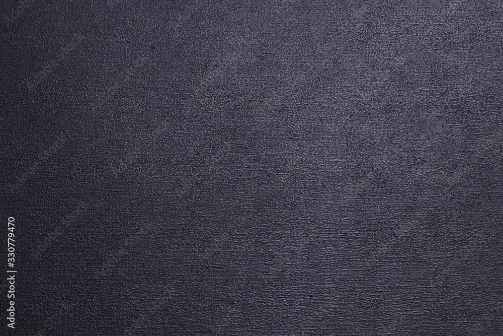 Black textured background with a gradient. Black textured background with a gradient.